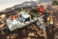 A man lays fruit and vegetables on top of his vehicle while selling them by the side of a busy road in Harare, Zimbabwe, Saturday, July 4, 2020. Cars have become mobile markets in Zimbabwe where enterprising residents are selling goods from their vehicles to cope with economic hardships caused by the coronavirus. With their car doors and trunks wide open by the side of busy roads, eager sellers display a colorful array of goods in Harare, the capital. (AP Photo/Tsvangirayi Mukwazhi)