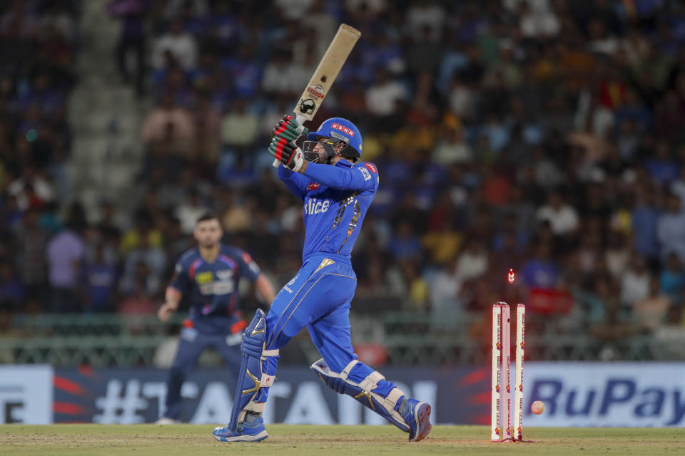 Mumbai Indians' Mohammad Nabi gets bowled out by Lucknow Super Giants' Mayank Yadav during the Indian Premier League cricket match between Lucknow Super Giants and Mumbai Indians in Lucknow, India, Tuesday, April 30, 2024. (AP Photo/Pankaj Nangia)