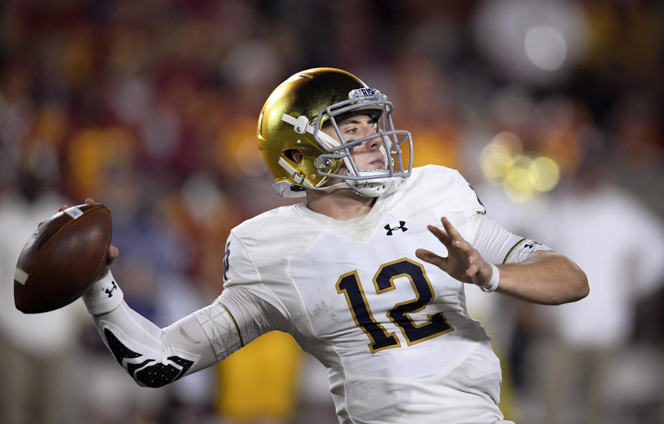 Notre Dame quarterback Ian Book throws a pass during the first half of the team's NCAA college football game against Southern California on Saturday, Nov. 24, 2018, in Los Angeles. (AP Photo/Mark J. Terrill)