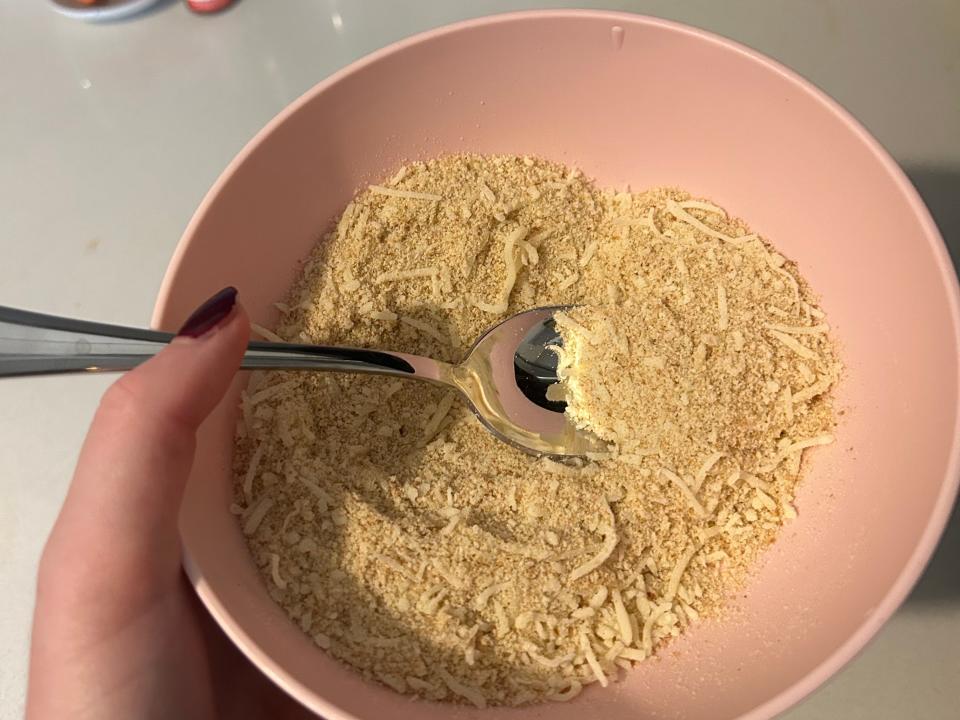 Bread crumbs and parmesan cheese mixed in a bowl.