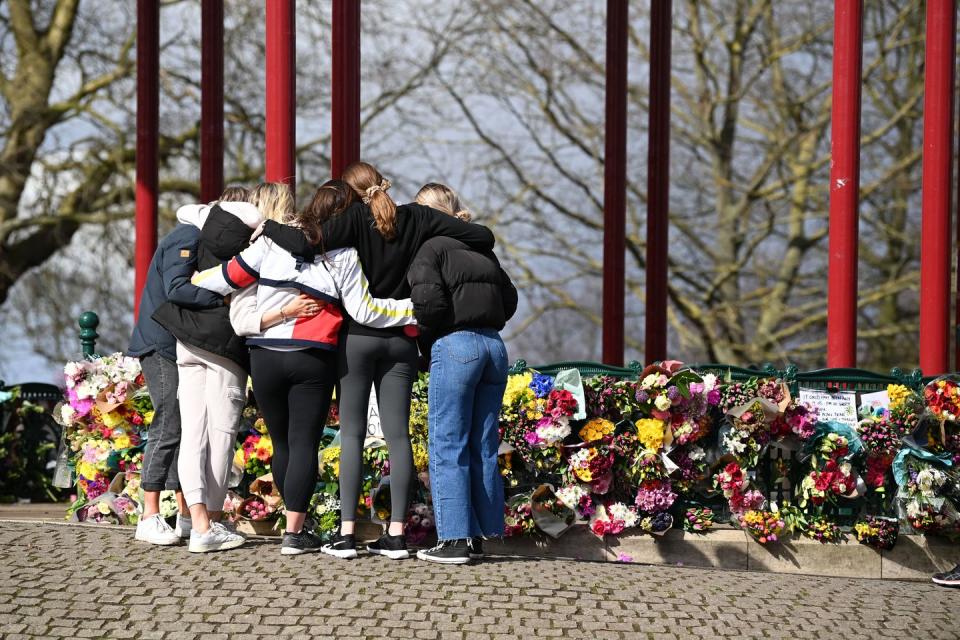 london, england march 13 a group of women hug as they stand in front of tributes for sarah everard at the bandstand on clapham common on march 13, 2021 in london, united kingdom vigils are being held across the united kingdom in memory of sarah everard yesterday, the police confirmed that the remains of ms everard were found in a woodland area in ashford, a week after she went missing as she walked home from visiting a friend in clapham metropolitan police officer wayne couzens has been charged with her kidnap and murder photo by leon nealgetty images