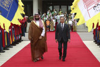 South Korean President Moon Jae-in, right, and Saudi Crown Prince Mohammed bin Salman view an honor guard during a welcoming ceremony at the presidential Blue House, Wednesday, June 26, 2019, in Seoul, South Korea. Bin Salman is visiting South Korea for two days - the first time by an heir to the throne of Saudi Arabia since 1998. (Chung Sung-Jun/Pool Photo via AP)