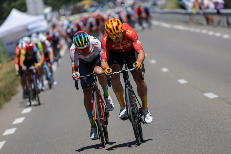 TotalEnergies' French rider Pierre Latour (L) and Uno-X Pro Cycling Team's Norwegian rider Jonas Abrahamsen (R) cycle ahead of the pack of riders during the 13th stage of the 110th edition of the Tour de France cycling race, 138 km between Chatillon-sur-Chalaronne in central-eastern France and Grand Colombier, in the Jura mountains, in France, on July 14, 2023. (Photo by Thomas SAMSON / AFP)