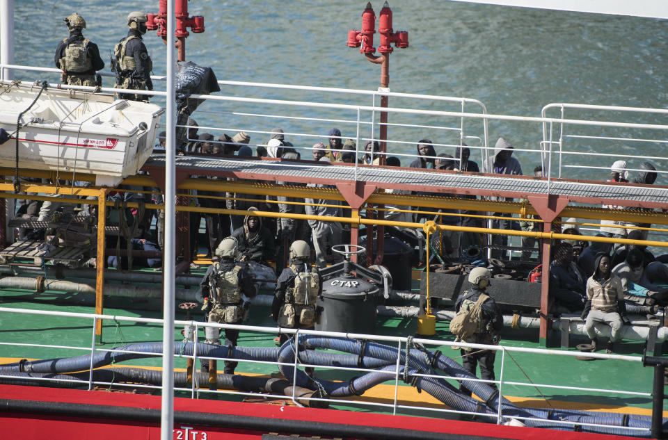 Armed forces stand onboard the Turkish oil tanker El Hiblu 1, which was hijacked by migrants, in Valletta, Malta, Thursday March 28, 2019. A Maltese special operations team on Thursday boarded a tanker that had been hijacked by migrants rescued at sea, and returned control to the captain, before escorting it to a Maltese port. (AP Photo/Rene' Rossignaud)