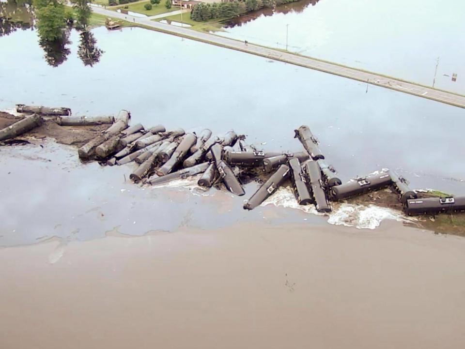 Tanker cars carrying crude oil are shown derailed about a mile south of Doon, Iowa (Sioux County Sheriff's Office)