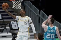 Dallas Mavericks forward James Johnson shoots past Charlotte Hornets forward Gordon Hayward during the first half of an NBA basketball game in Charlotte, N.C., Wednesday, Jan. 13, 2021. (AP Photo/Chris Carlson)