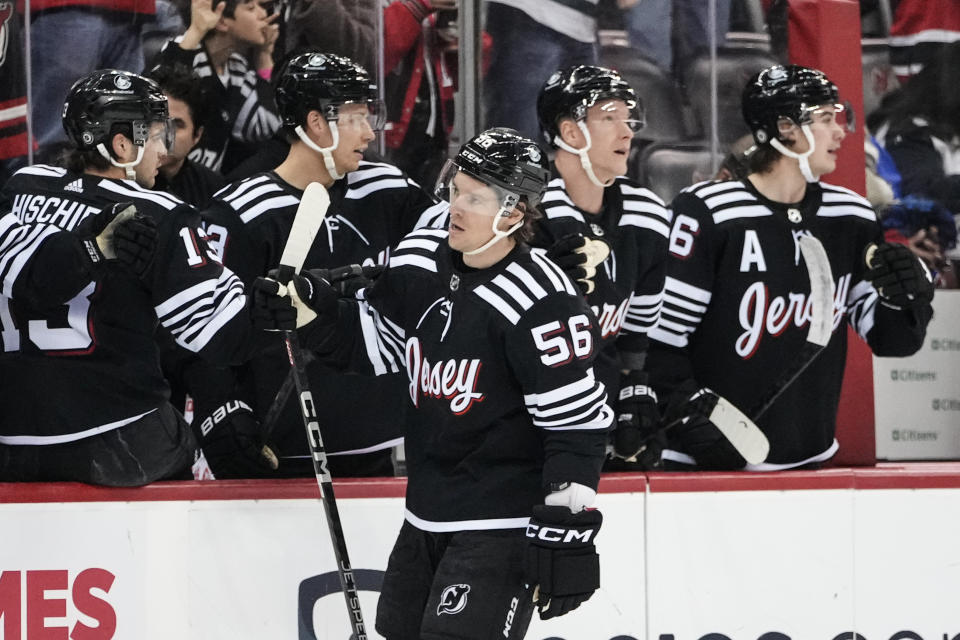 New Jersey Devils' Erik Haula (56) celebrates with teammates after scoring a goal during the first period of an NHL hockey game against the New York Rangers Thursday, March 30, 2023, in Newark, N.J. (AP Photo/Frank Franklin II)