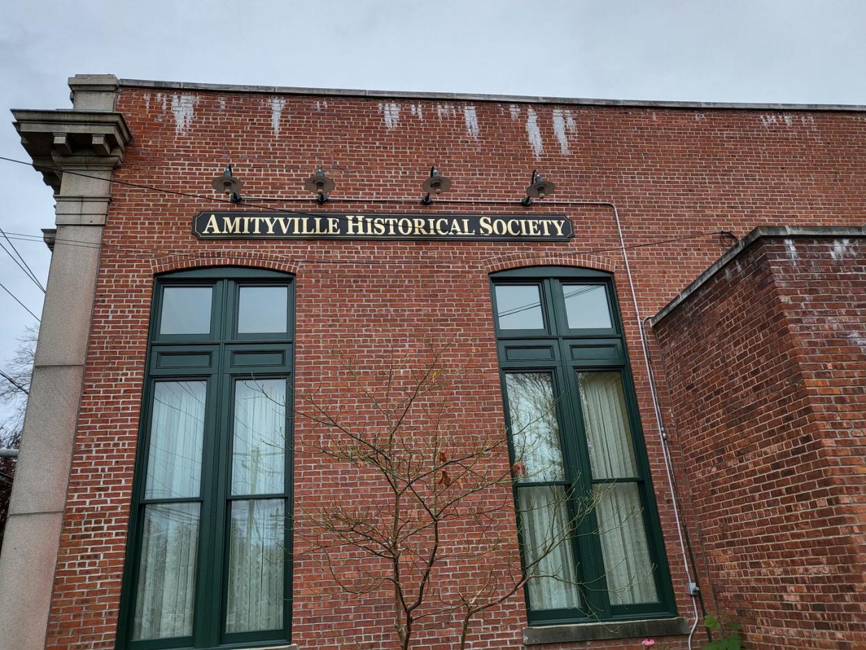 exterior of brick amityville historical society building