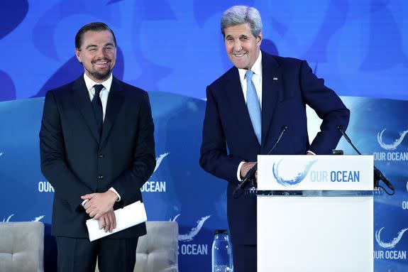 U.S. Secretary of State John Kerry (R) introduces actor and environmental activist Leonardo DiCaprio during the Our Oceans Conference in Washington, Sept. 15, 2016.