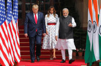 U.S. President Donald Trump, first lady Melania Trump and India's Prime Minister Narendra Modi walk ahead of their meeting at Hyderabad House in New Delhi, India, February 25, 2020. REUTERS/Adnan Abidi