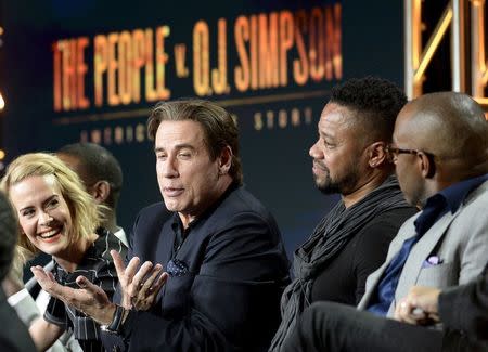 Cast member John Travolta (C) speaks as Sarah Paulson (L) and Cuba Gooding Jr., (2nd R) look on as they participate in a panel for the FX Networks "The People v. O.J. Simpson: American Crime Story" during the Television Critics Association (TCA) Cable Winter Press Tour in Pasadena, California in this January 16, 2016 file photo. REUTERS/Kevork Djansezian/Files