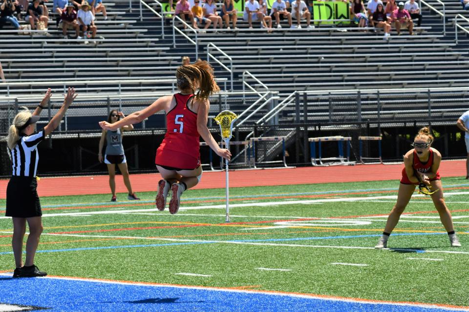 Lenape junior Lily Bunting celebrates a goal as twin sister Emma looks on at the 2022 NJSIAA Group 4 girls lacrosse championship at Warren Hills High School