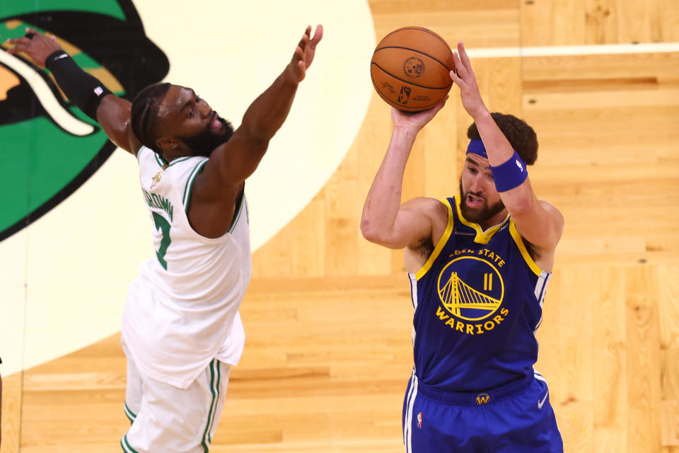 BOSTON, MASSACHUSETTS - JUNE 16: Klay Thompson #11 of the Golden State Warriors shoots over Jaylen Brown #7 of the Boston Celtics during the second quarter in Game Six of the 2022 NBA Finals at TD Garden on June 16, 2022 in Boston, Massachusetts. NOTE TO USER: User expressly acknowledges and agrees that, by downloading and/or using this photograph, User is consenting to the terms and conditions of the Getty Images License Agreement. (Photo by Adam Glanzman/Getty Images)