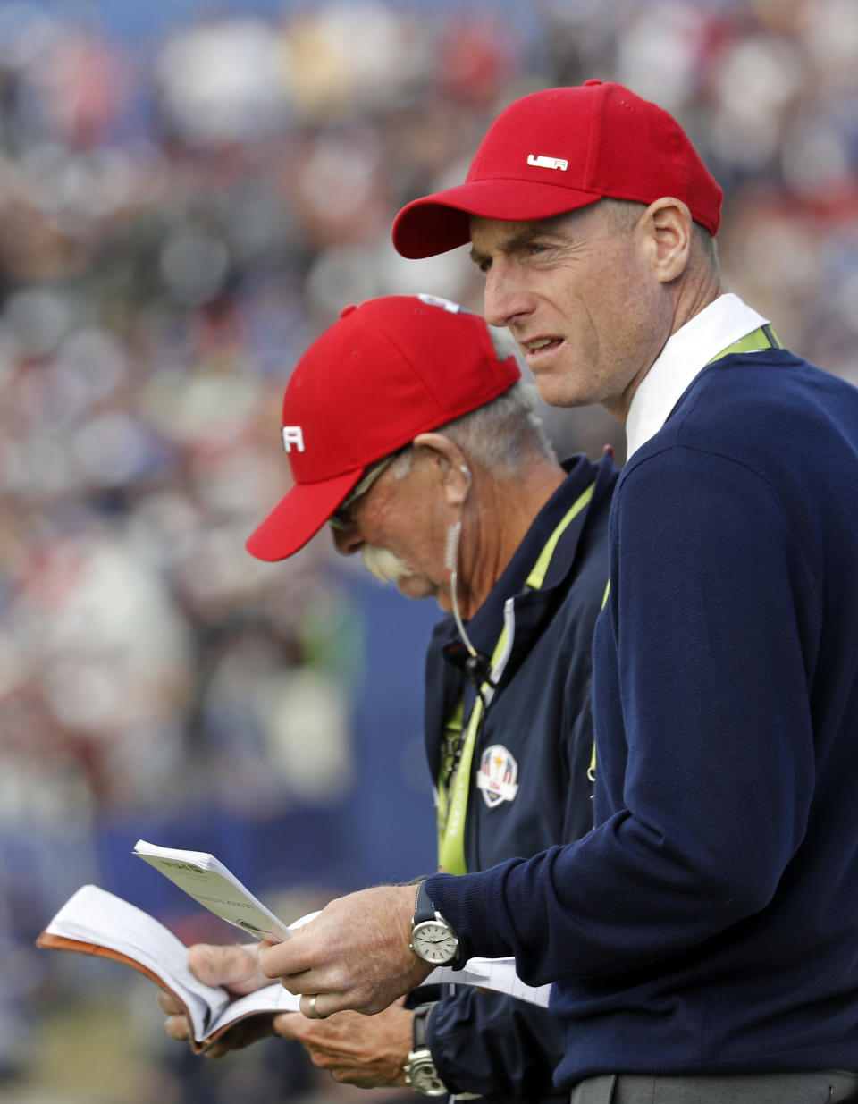 US team captain Jim Furyk watches the singles on the final day of the 42nd Ryder Cup at Le Golf National in Saint-Quentin-en-Yvelines, outside Paris, France, Sunday, Sept. 30, 2018. (AP Photo/Laurent Cipriani)