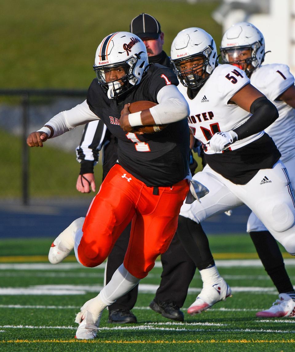 Cathedral Prep's Carter Barnes #1 runs for a gain in the 2nd quarter on Saturday. Prep was held to 182 yards of offense led by Barnes with 85 yards on 20 carries. The Ramblers lost to the Panthers, 42-7.