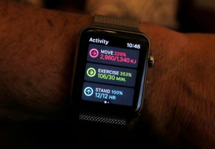 FILE PHOTO: An Apple Watch activity app shows completed move, exercise and standing goals for the day in this illustration image taken in Sydney, Australia, September 21, 2017.  Picture taken September 21, 2017.   REUTERS/Jason Reed/Illustration/File Photo