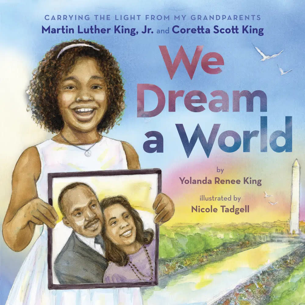 This cover image released by Scholastic shows “We Dream a World” by Yolanda Renee King, granddaughter of Coretta Scott King and Martin Luther King, Jr. (Orchard Books/Scholastic via AP)