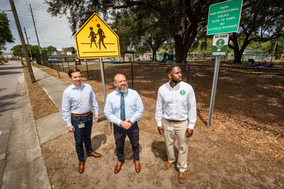Michael Manning , left, Assistant to the City Manager, City Manager  James Slaton and CRA Project Manager Darrell Starling stand along Lincoln Avenue in Lake Wales' Northwest Neighborhood. Lake Wales has received a Community Development Block Grant of $1.2 million that it plans to use for building and improving sidewalks in the Northwest Neighborhood.