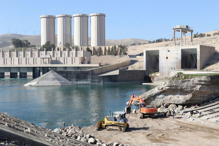 Employees work at strengthening the Mosul Dam in northern Iraq, in this file picture taken February 3, 2016. REUTERS/Azad Lashkari/Files