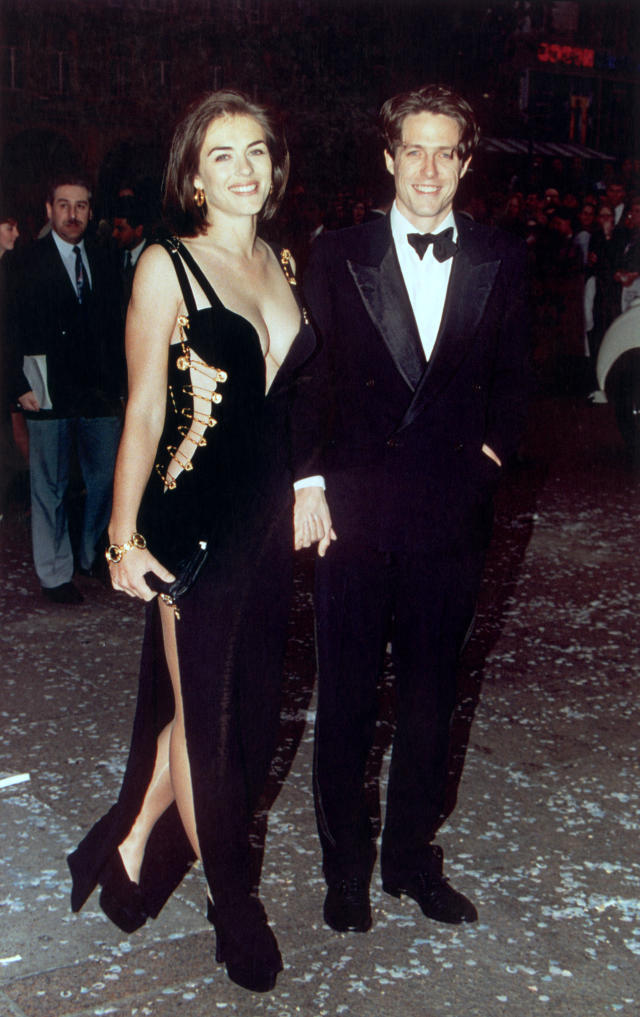 British actor Hugh Grant and his girlfriend Elizabeth Hurley attend the premiere of Grant's latest film, 'Four Weddings and a Funeral' in London, 11th May 1994. (Photo by Gareth Davies/Mission Pictures/Getty Images) *** North American Sales Only ***  