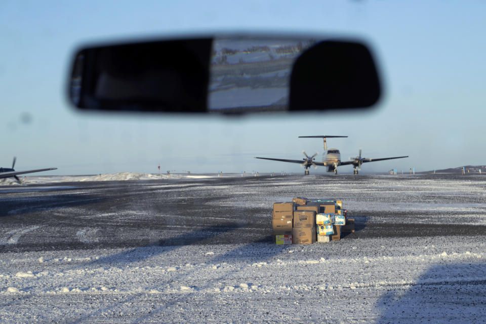 In this Feb. 19, 2019, photo, a pile of deliveries sit on the tarmac of the airport in the Native Village of St. Michael, Alaska, population 400. Transportation from villages to Nome is limited to air travel. (AP Photo/Wong Maye-E)