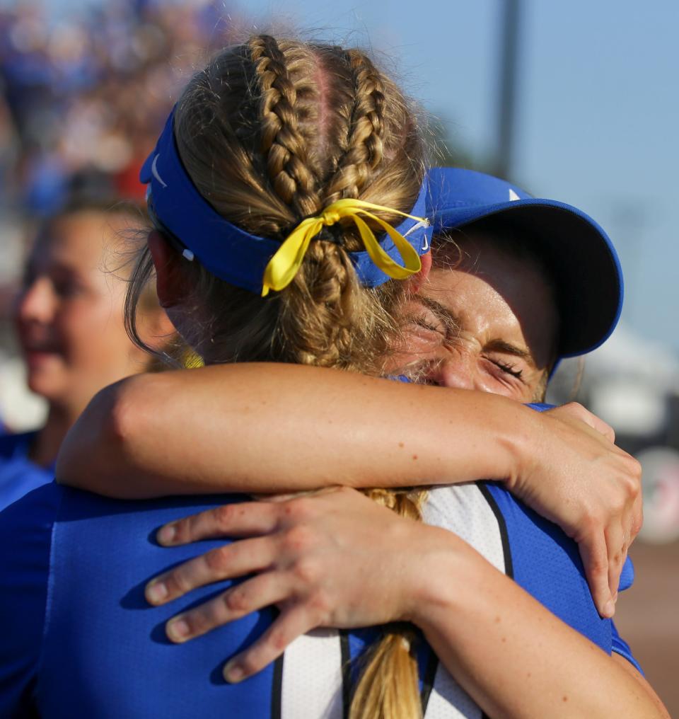 Waukee Northwest players celebrate beating Fort Dodge during the Class 5A softball state championship at Harlan Rogers Sports Complex on Thursday in Fort Dodge.