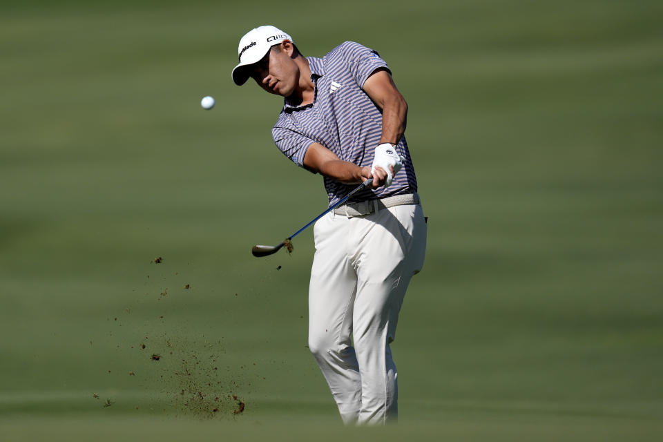 Collin Morikawa chips onto the 14th green during the third round of The Sentry golf event, Saturday, Jan. 6, 2024, at Kapalua Plantation Course in Kapalua, Hawaii. (AP Photo/Matt York)