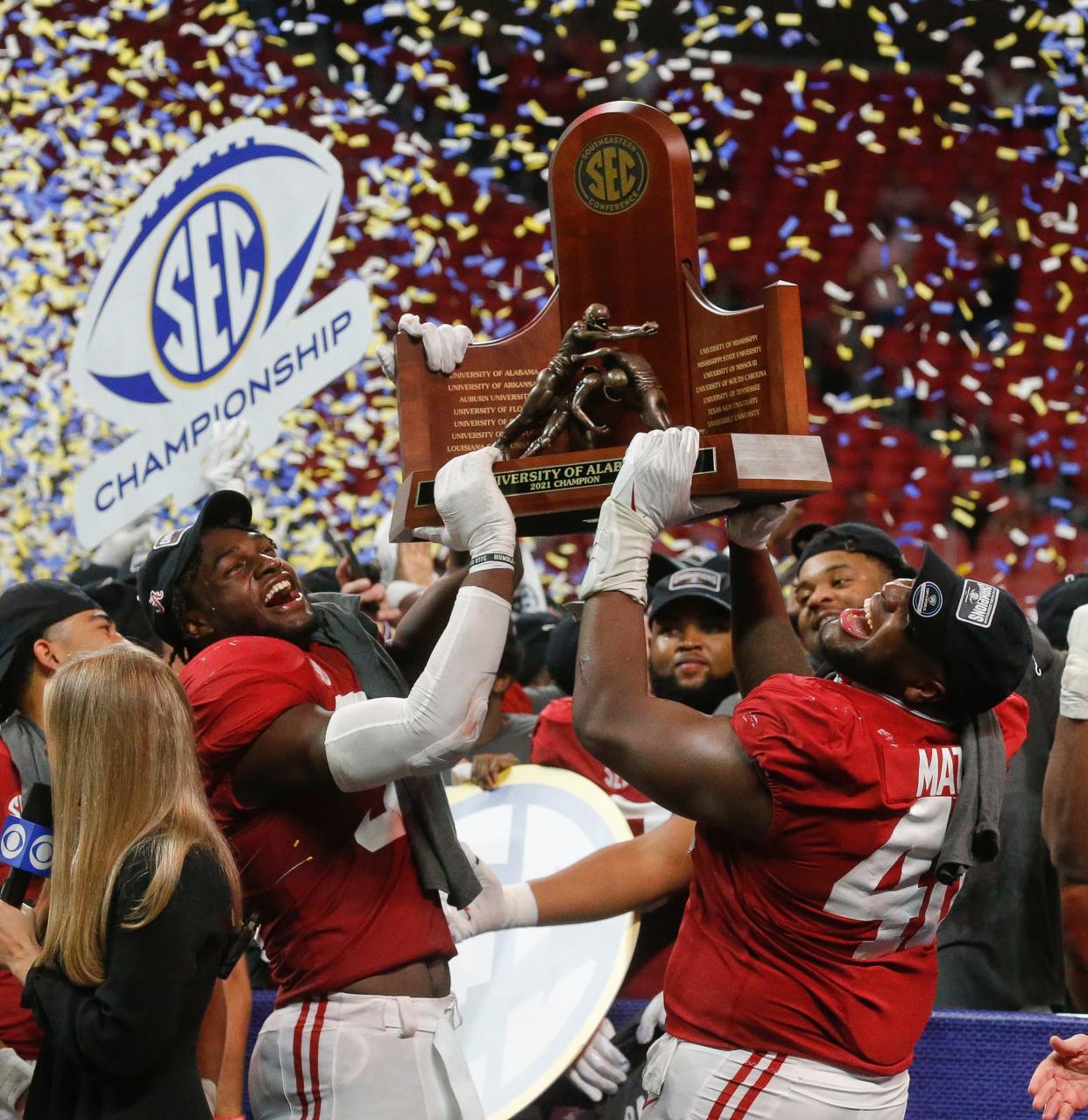 Dec 4, 2021; Atlanta, GA, USA; Alabama linebacker Will Anderson Jr. (31) and Alabama defensive lineman Phidarian Mathis (48) hoist the trophy after the SEC championship game at Mercedes-Benz Stadium. Alabama defeated Georgia 41-24. Mandatory Credit: Gary Cosby Jr.-USA TODAY Sports