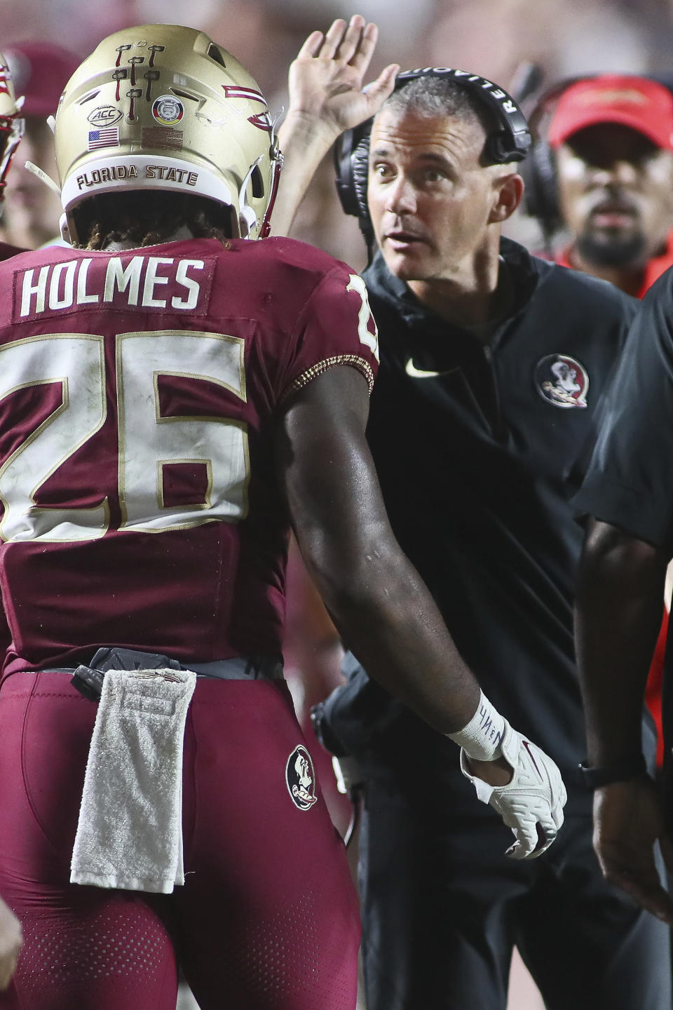 Florida State head coach Mike Norvell congratulates running back Caziah Holmes (26) after his touchdown in the fourth quarter of an NCAA college football game against Southern Mississippi, Saturday, Sept. 9, 2023, in Tallahassee, Fla. FSU won 66-13. (AP Photo/Phil Sears)