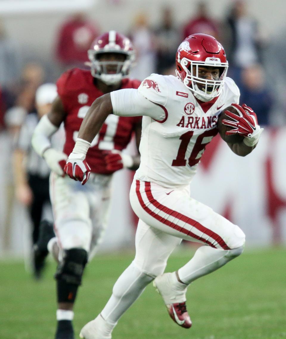 Arkansas wide receiver Treylon Burks (16) runs for a touchdown after making a catch against Alabama last Saturday at Bryant-Denny Stadium in Tuscaloosa, Ala.