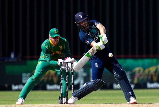 England captain Jos Buttler, right, plays a stroke shot 