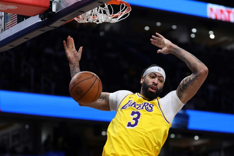 <a class="link " href="https://sports.yahoo.com/nba/teams/la-lakers/" data-i13n="sec:content-canvas;subsec:anchor_text;elm:context_link" data-ylk="slk:Los Angeles Lakers;sec:content-canvas;subsec:anchor_text;elm:context_link;itc:0">Los Angeles Lakers</a> star <a class="link " href="https://sports.yahoo.com/nba/players/5007/" data-i13n="sec:content-canvas;subsec:anchor_text;elm:context_link" data-ylk="slk:Anthony Davis;sec:content-canvas;subsec:anchor_text;elm:context_link;itc:0">Anthony Davis</a> slams in a dunk in his team's 125-120 NBA victory at Washington, in which Davis had 35 points and 18 rebounds (Patrick Smith)