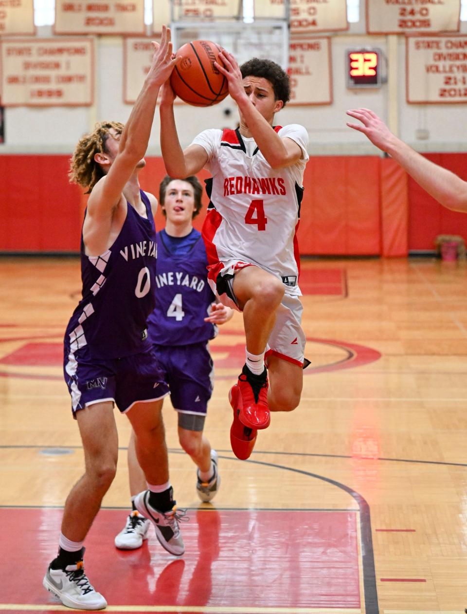 Gabe Pichardo of Barnstable goes up against Tysean Thomas of Martha's Vineyard on Dec. 27, 2023, in Hyannis.