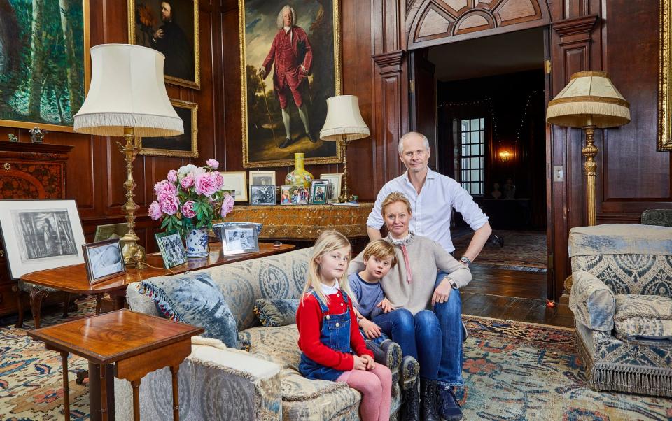 Charlotte Carew Pole with her husband and their two children in their stately home