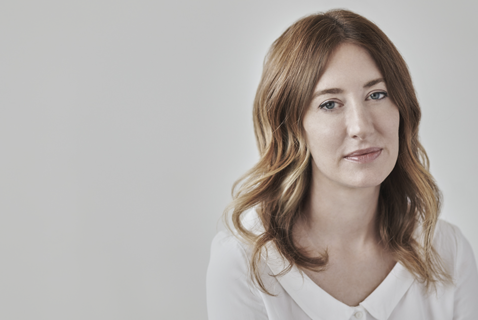 shelley selim dia design curator with long hair in white dress