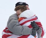 <p>Shaun White embraces his father after winning his third Olympic gold medal. White laid down a massive third run to overtake Ayumu Hirano of Japan. </p>