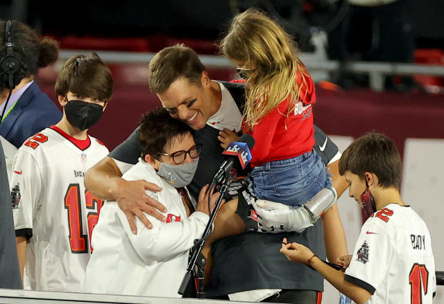 Feb 7, 2021; Tampa, FL, USA; Tampa Bay Buccaneers center Ryan Jensen (66)  celebrates with his son, Wyatt, after the Tampa Bay Buccaneers beat the  Kansas City Chiefs in Super Bowl LV