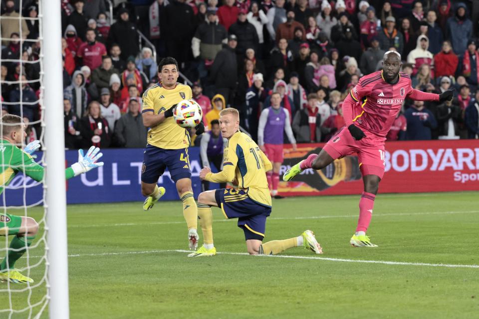 St. Louis City SC forward Samuel Adeniran, right, shoots past Real Salt Lake defender Justen Glad (15) to score in the second half of an MLS soccer match Saturday, Feb. 24, 2024, St. Louis. (Laurie Skrivan/St. Louis Post-Dispatch via AP)