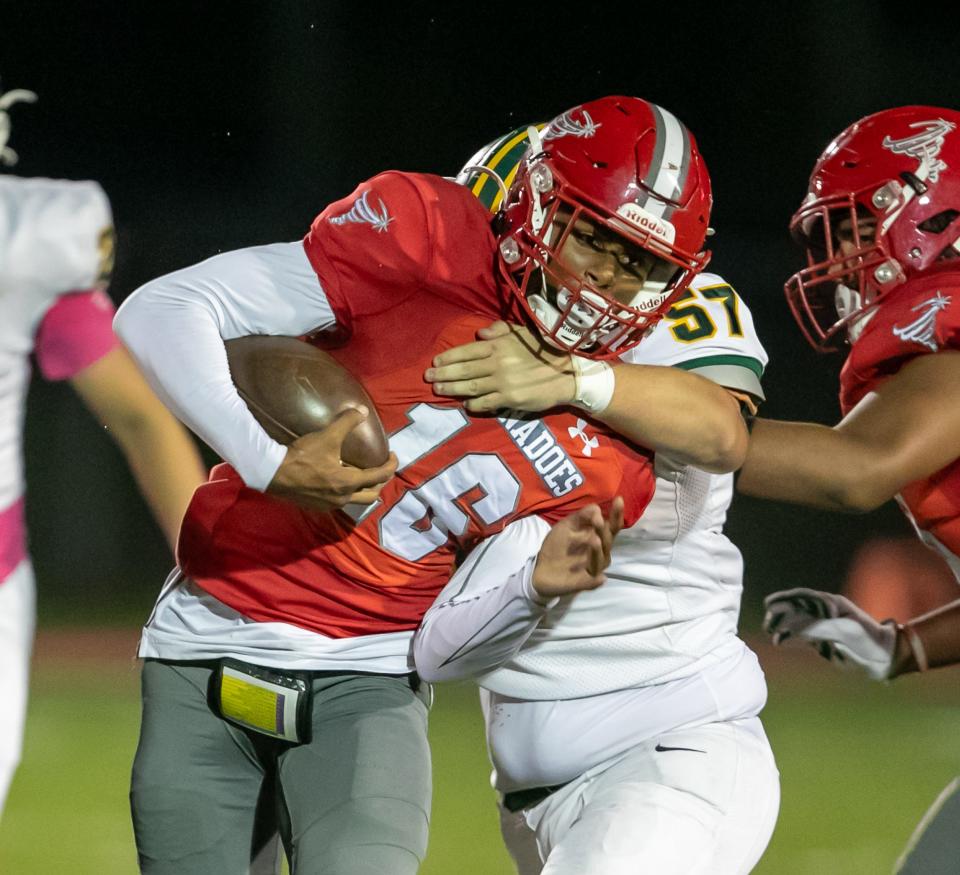 Bradford Jeremiah Mckenzie (16) gets slowed down by Lecanto guard Connor Bornschein (57) as Bradford takes on Lecanto at Bradford High School in Starke, FL on Friday, October 20, 2023. [Alan Youngblood/Gainesville Sun]