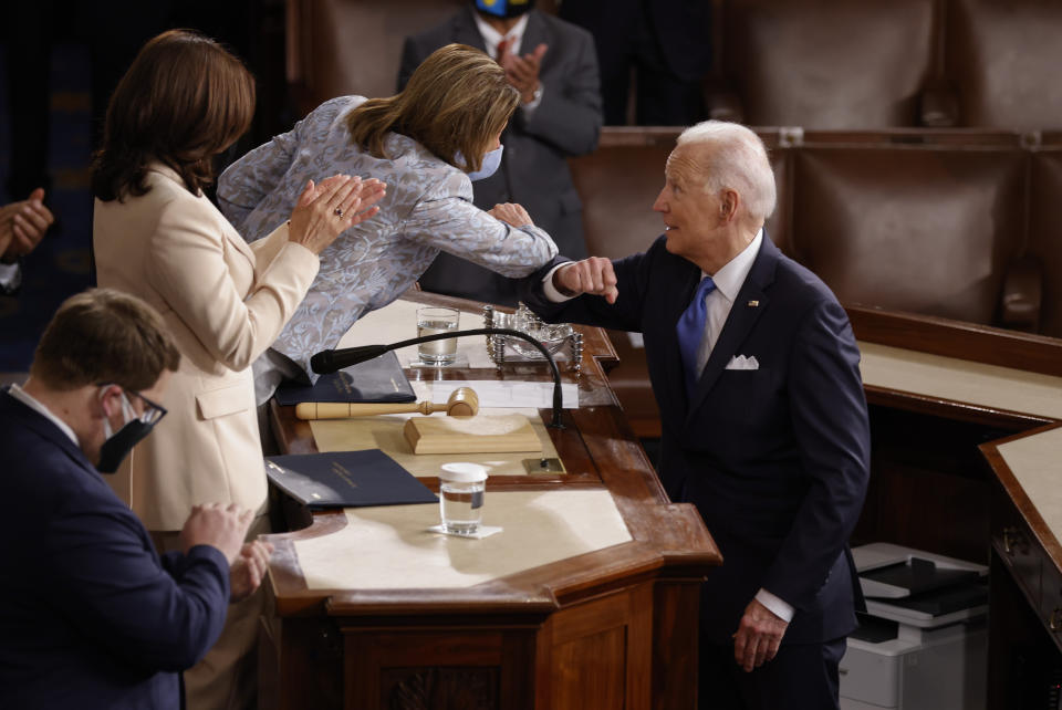 President Joe Biden elbow bumps House Speaker Nancy Pelosi after he addressed a joint session of Congress, Wednesday, April 28, 2021, in the House Chamber at the U.S. Capitol in Washington. (Jonathan Ernst/Pool via AP)