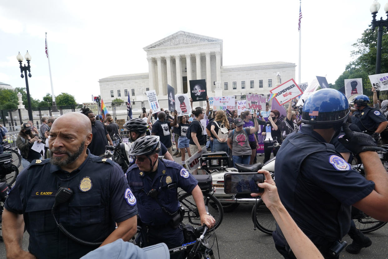 Abortion rights and anti-abortion rights demonstrators protest (Steve Helber / AP)