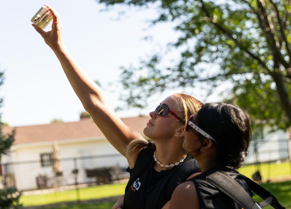 Eliza Collings, of Alpine, left, and Anu Arumugarasa, Sri Lanka, take a selfie together after their #SheBelongs soccer practice at Lone Peak Park in Sandy on Thursday, July 6, 2023. #SheBelongs is a four-month program bringing together refugee and nonrefugee girls through soccer. | Megan Nielsen, Deseret News