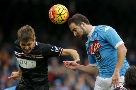 Football Soccer - Napoli v Carpi Serie A - San Paolo Stadium, Naples, Italy - 07/02/16. Napoli's Gonzalo Higuain (R) and Carpi's Simone Romagnoli in action. REUTERS/Stringer