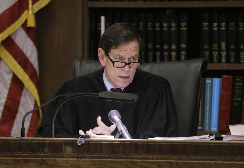 Judge Jeffrey Locke speaks to members of the jury before closing arguments in the trial of former New England Patriots tight end Aaron Hernandez at Suffolk Superior Court, Thursday, April 6, 2017, in Boston. Hernandez is on trial for the July 2012 killings of Daniel de Abreu and Safiro Furtado who he encountered in a Boston nightclub. The former NFL player is already serving a life sentence in the 2013 killing of semi-professional football player Odin Lloyd. (AP Photo/Steven Senne, Pool)