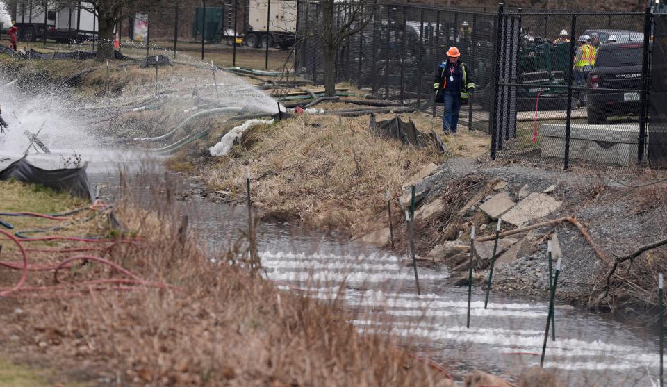 East Palestine residents on Wednesday, March 22, 2023, after a train derailed February 3. An overheated wheel bearing caused the dangerous derailment that spilled more than 100,000 gallons of toxic chemicals into the air and a fire burst into flames that night.