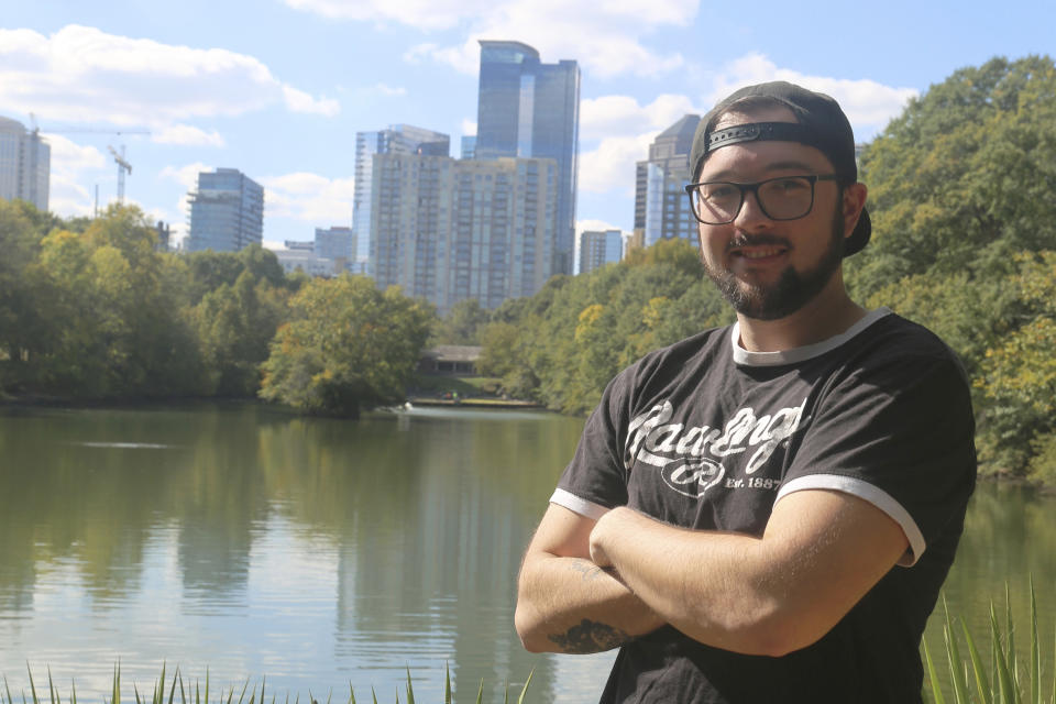 Film lighting technician Ed O'Hare stands in Atlanta's Piedmont Park on Oct. 18, 2023. With the actors' strike still ongoing and filming largely shut down, O'Hare has been mowing lawns and doing other odd jobs to make ends meet. (AP Photo/R.J. Rico)