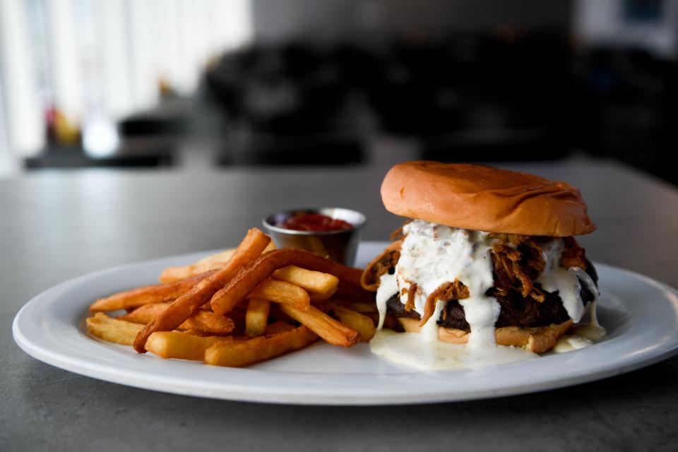 The Corner burger with house-roasted poblano quest with ranch and pull pork with a well-done patty. This burger will be a specialty burger served at Geodis Stadium in Nashville, Tenn., Wednesday, April 20, 2022. 