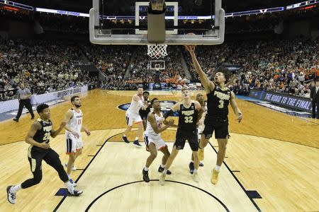 Mar 30, 2019; Louisville, KY, United States; Purdue Boilermakers guard Carsen Edwards (3) shoots as Virginia Cavaliers guard De'Andre Hunter (12) looks on during the second half in the championship game of the south regional of the 2019 NCAA Tournament at KFC Yum Center. Mandatory Credit: Jamie Rhodes-USA TODAY Sports