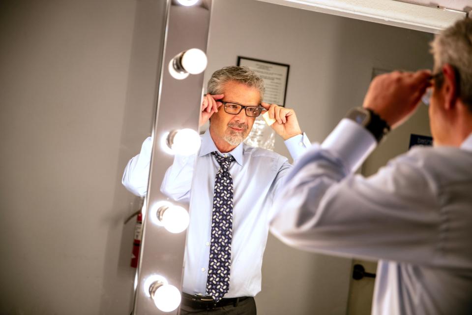 Fred Roggin adjusts his glasses inside NBC Palm Springs studio in Palm Desert, Calif., on Nov. 27, 2023. Roggin will be doing a new show for NBC Palm Springs beginning in January.