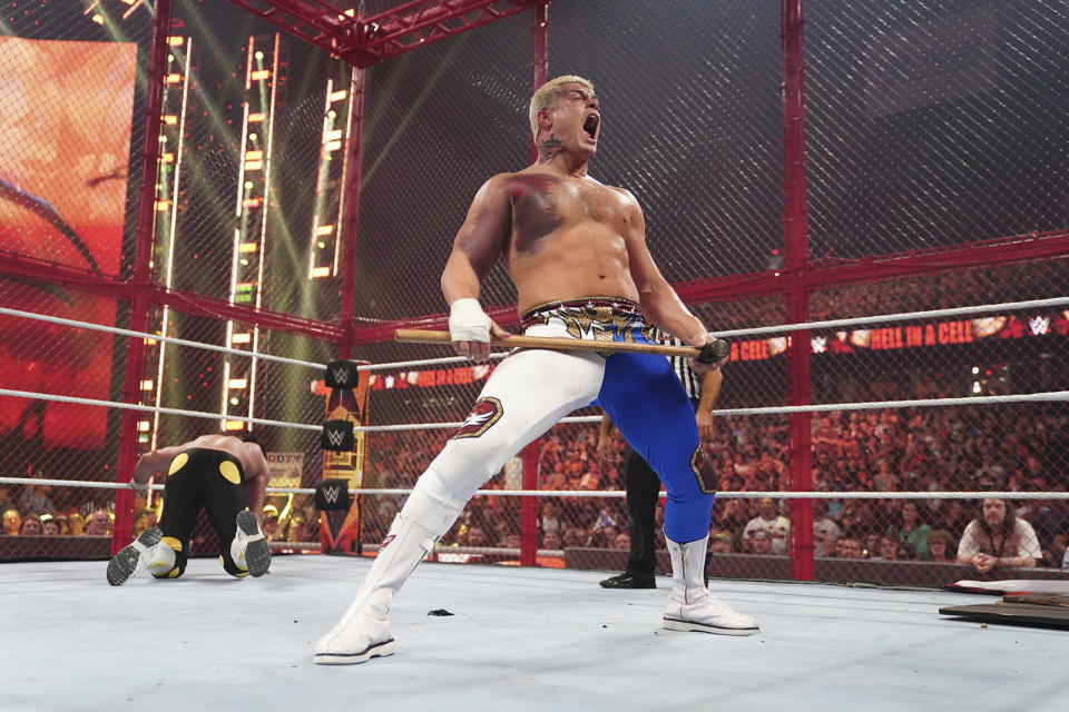 Cody Rhodes takes part in a match during a WWE premium live event in Rosemont, Illinois, on June 5, 2022. Rhodes participated in the match despite suffering a torn pectoral muscle that would sideline him for seven months. Rhodes will participate in the main event of WrestleMania 39 on April 2, 2023, in Los Angeles.(WWE via AP)